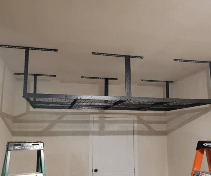 an overhead storage rack in a garage