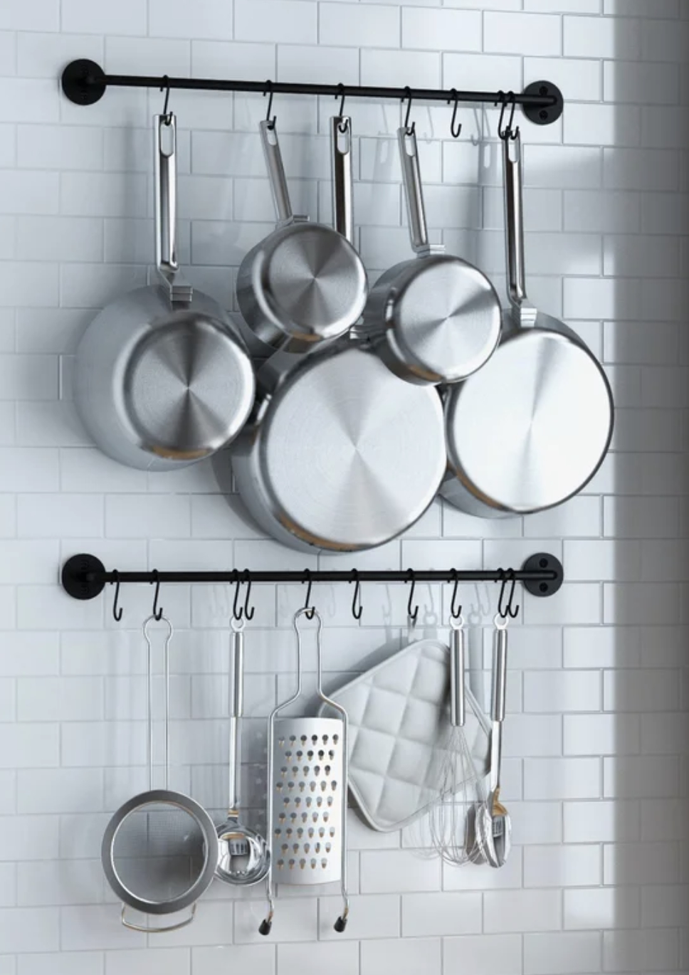 pots and pans hanging from two pot hangers