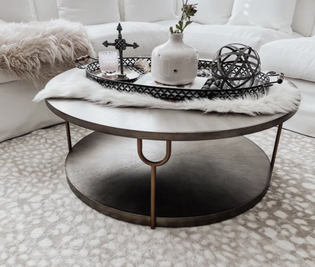 a round shelved coffee table in a living room