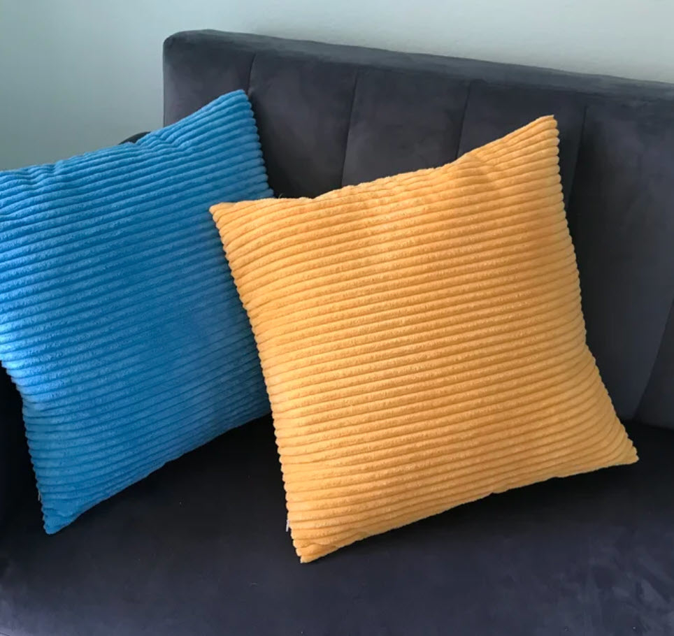 blue and light orange ribbed velvet throw pillows