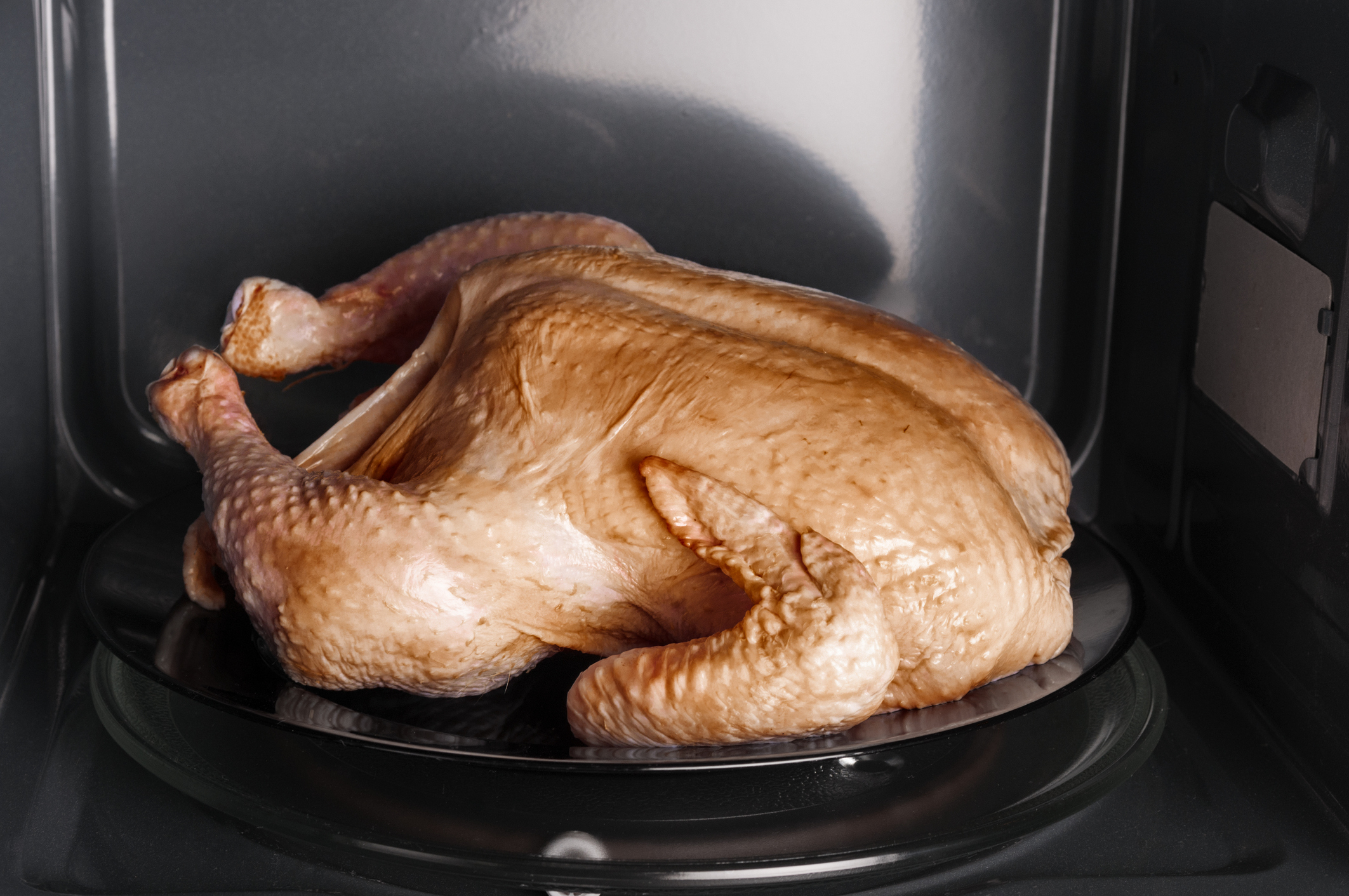 A whole chicken in a microwave