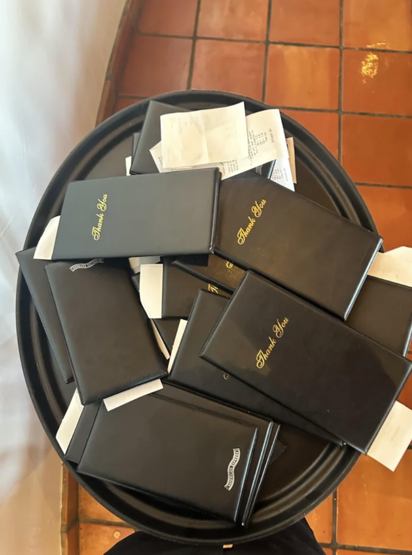 a pile of restaurant bills