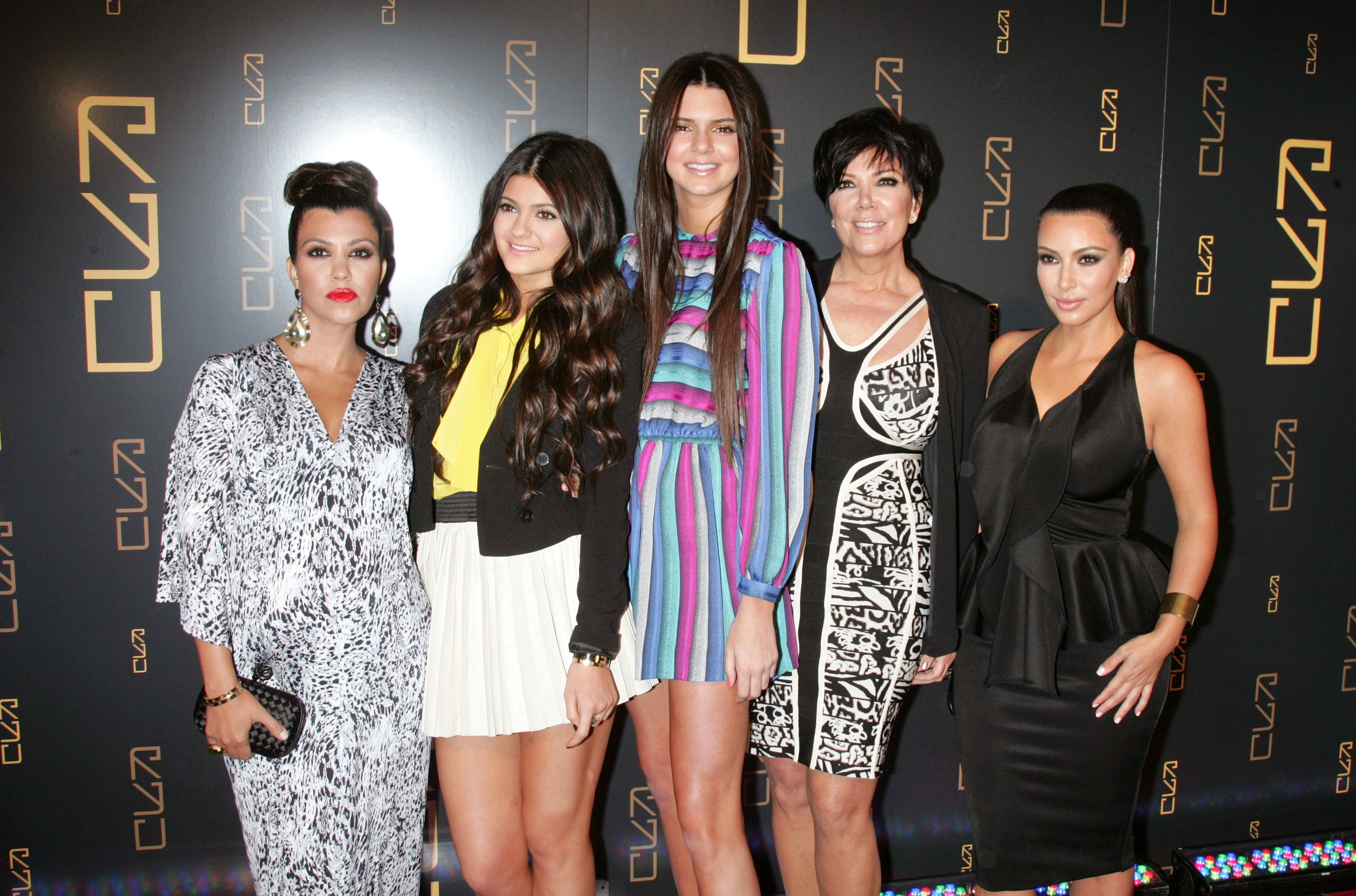 Kourtney, Kim, Kris, and Kylie and Kendall Jenner at a media event
