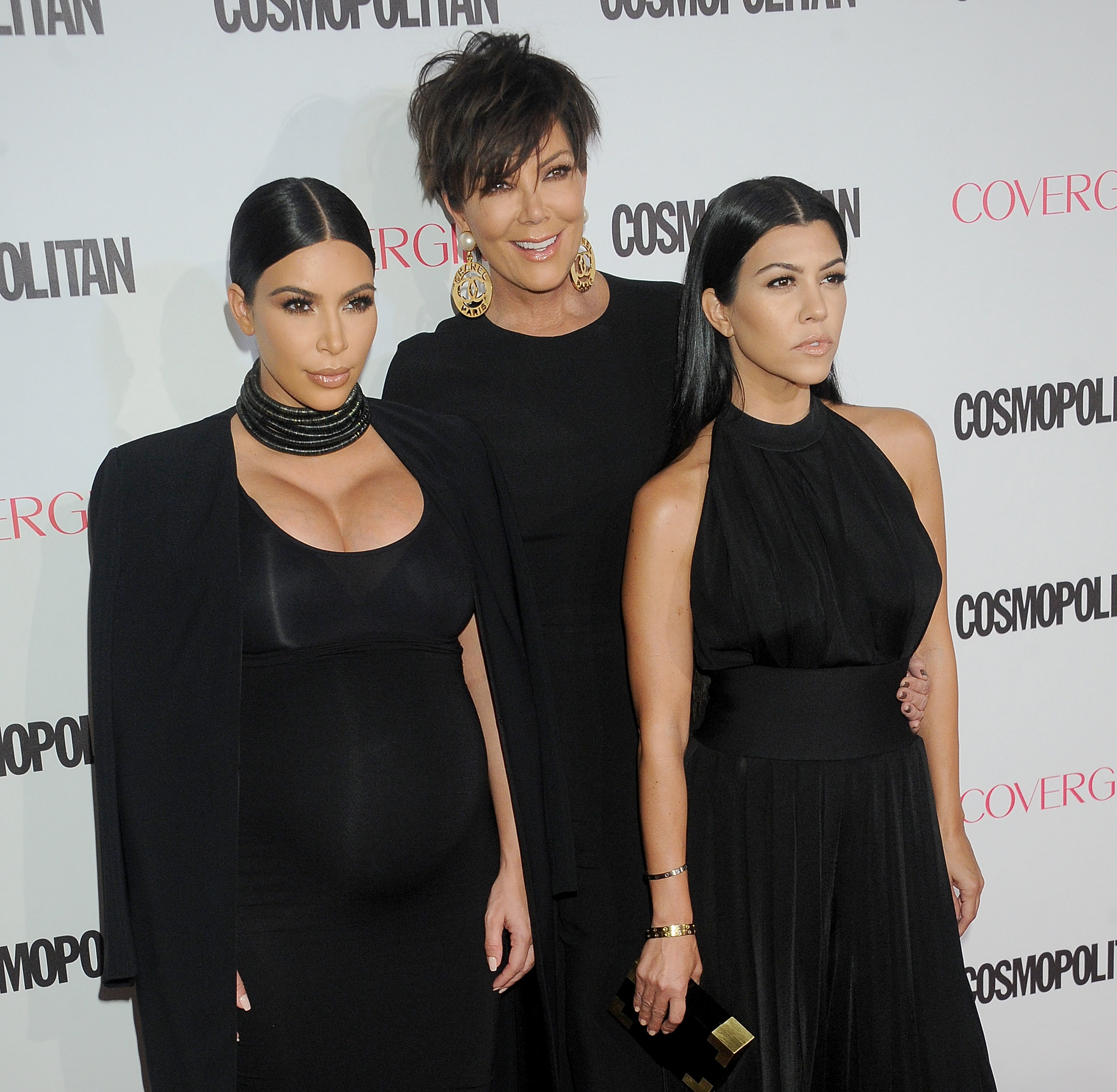 Kourtney and Kim with Kris at a media event
