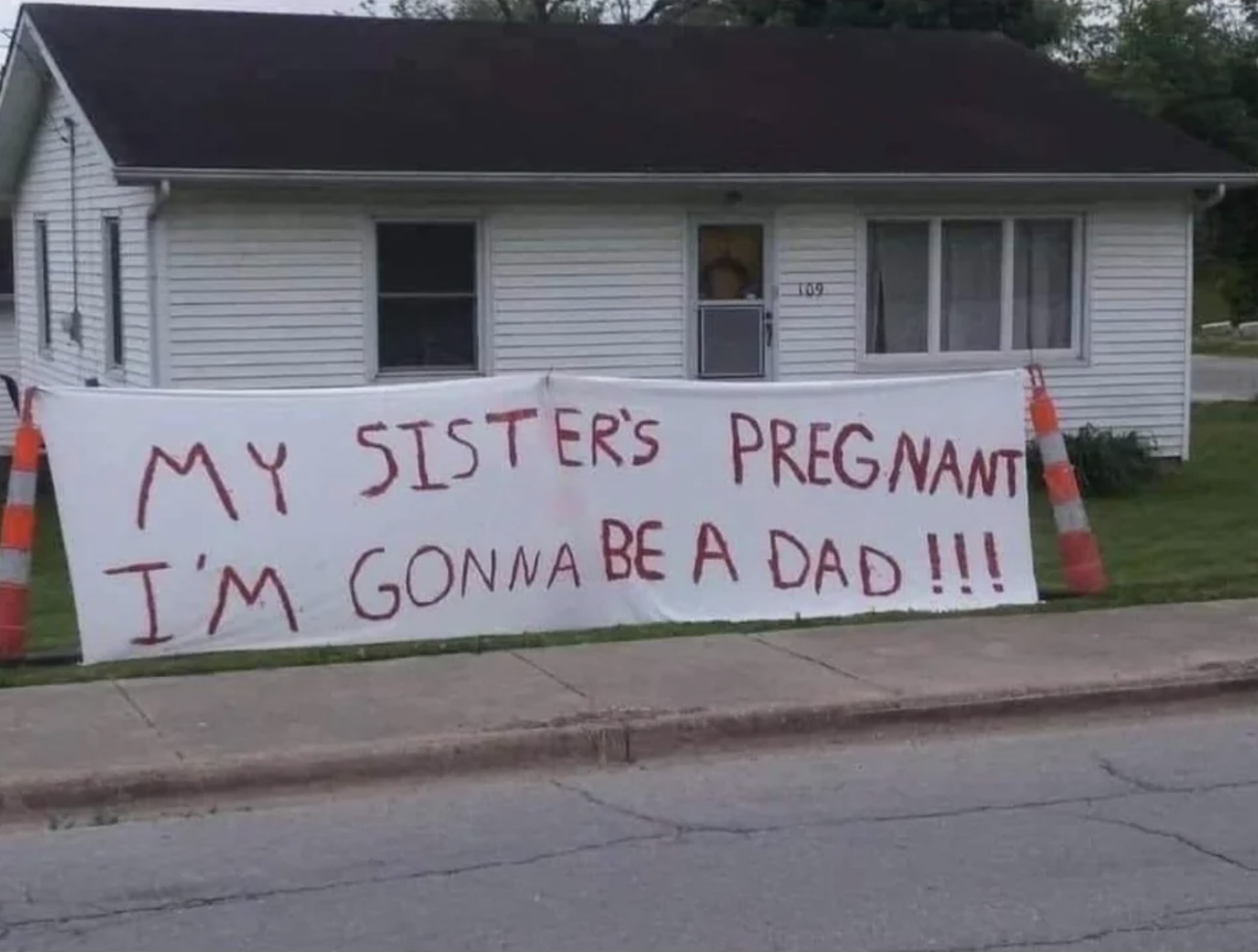 large banner in front of a house says, my sister&#x27;s pregnant i&#x27;m gonna be a dad