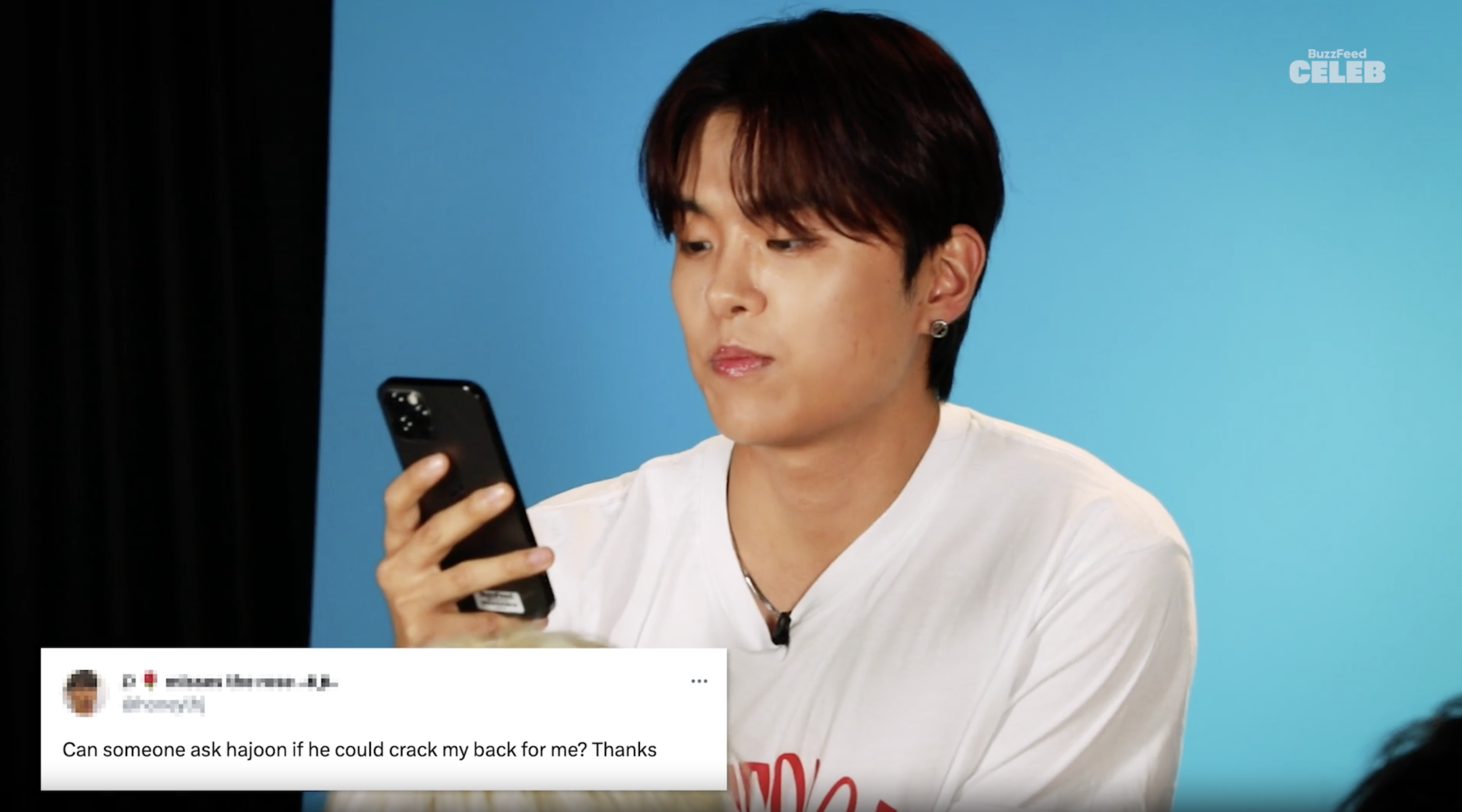Closeup of one of the members reading a tweet