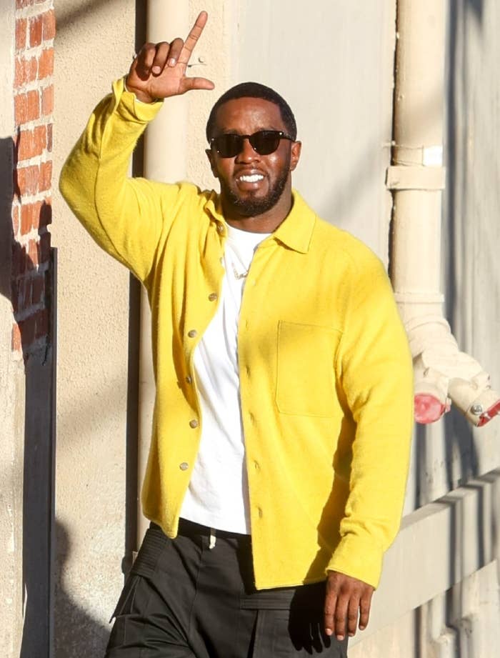 Diddy smiling and waving