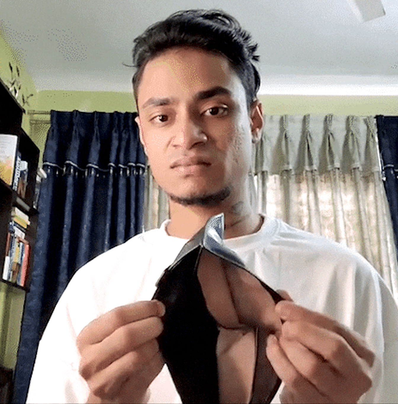 a man holding open a completely empty wallet