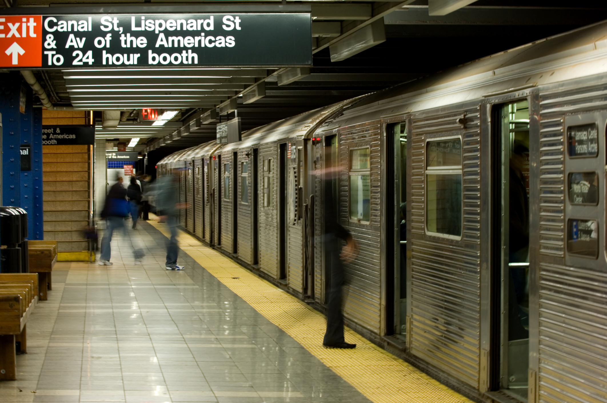 blurry people on the subway platform