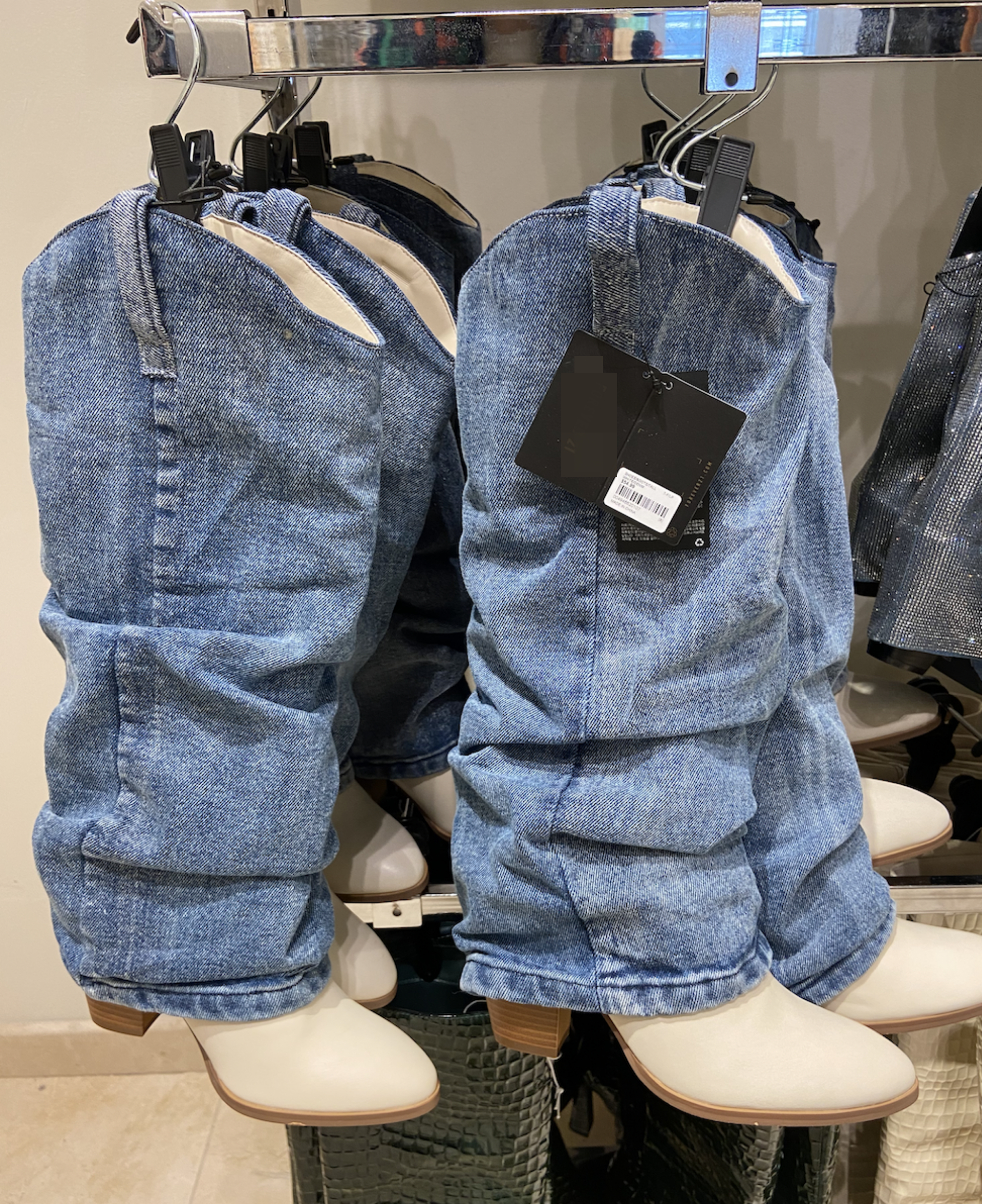 Boots that have faux jean pant legs attached to them