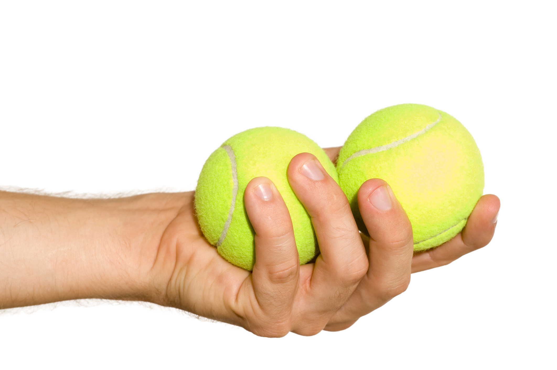 hand holding two tennis balls