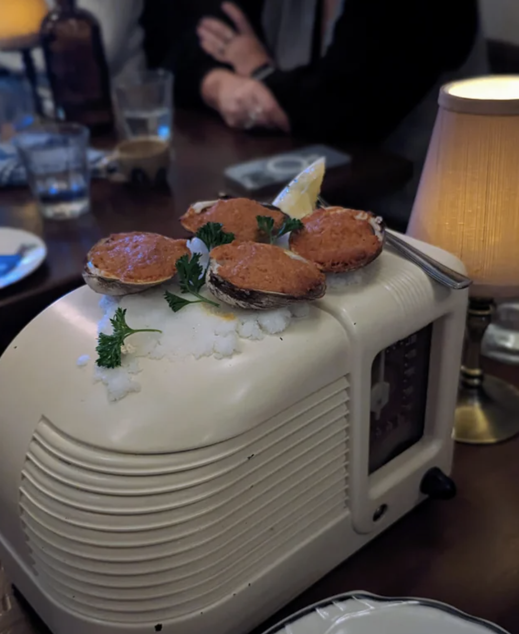There are clams on top of a radio