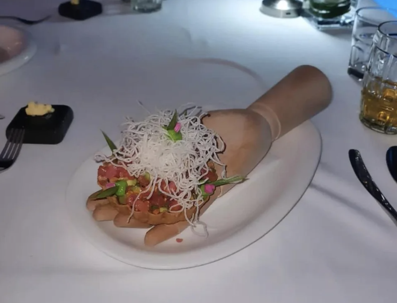 Salsa is served on a mannequin hand