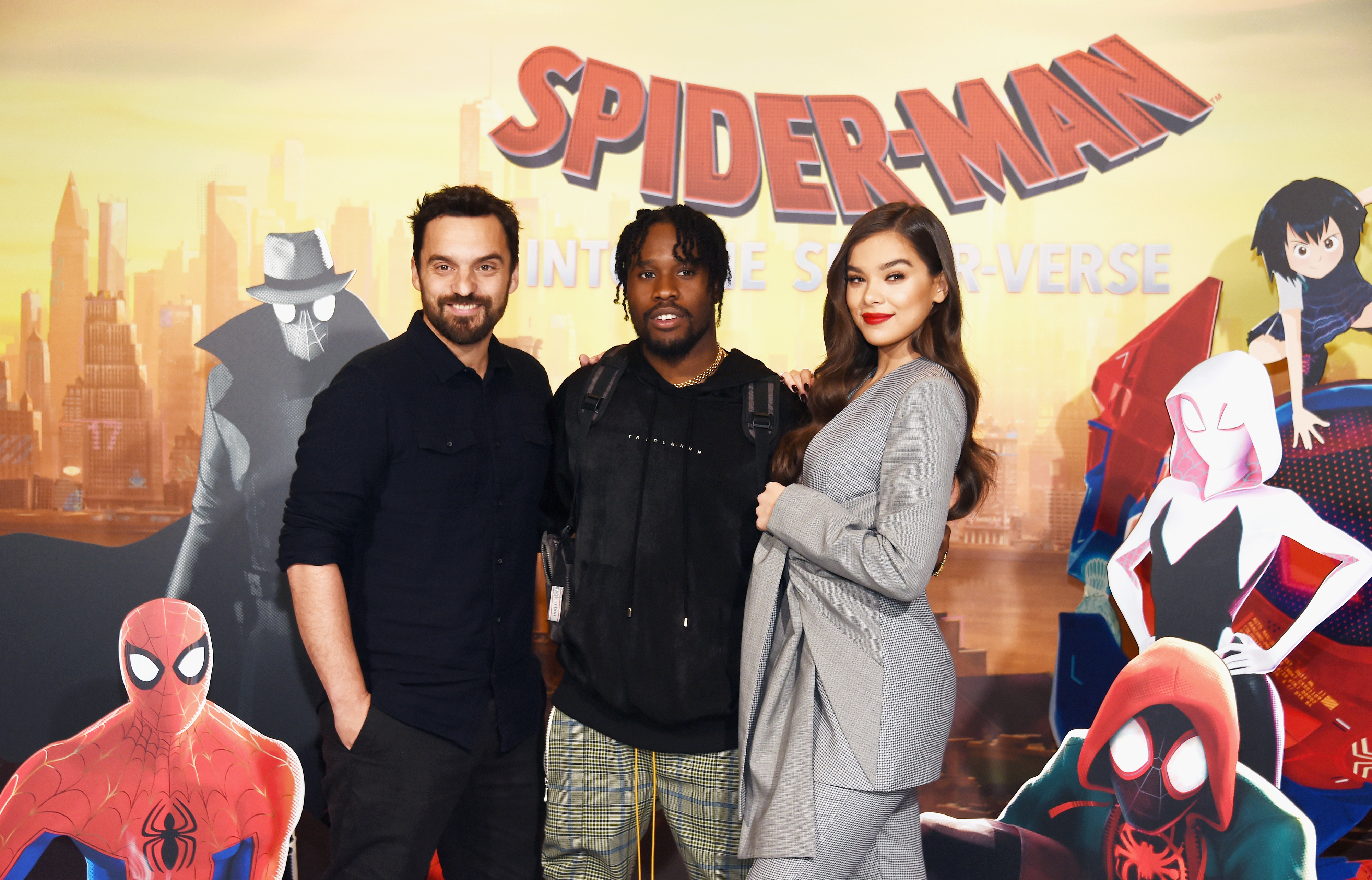 Jake Johnson, Shameik Moore, and Hailee Steinfeld from Spider-Man: Into the Spider-Verse standing together