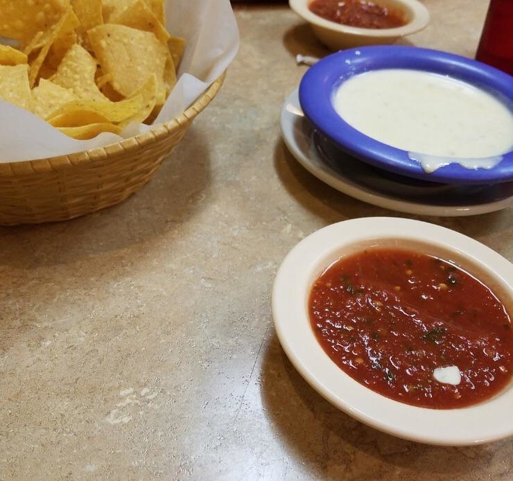 salsa with queso and chips at a mexican restaurant