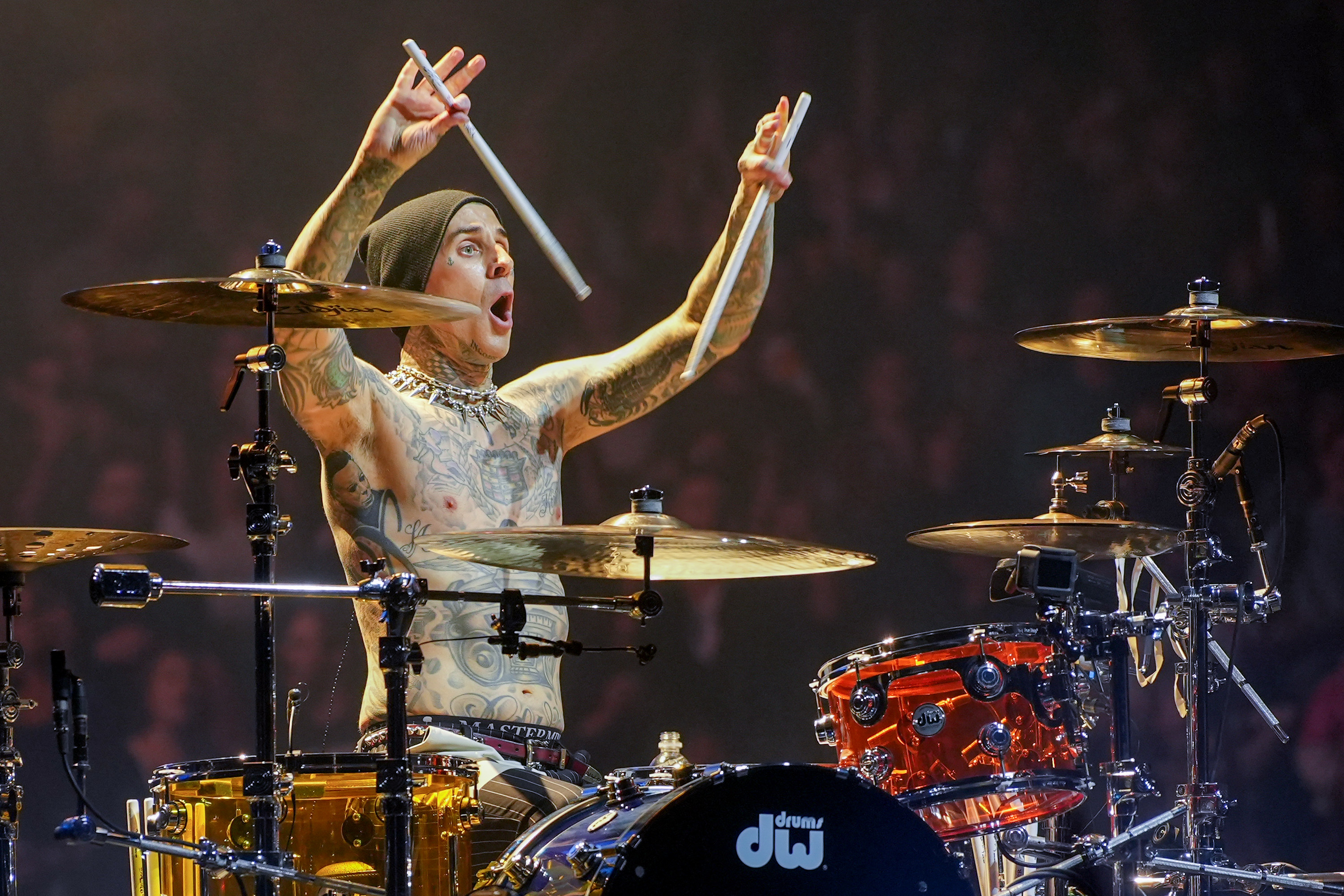 Close-up of Travis playing drums