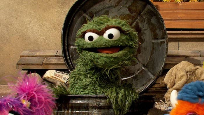 Oscar the Grouch popping out his bin