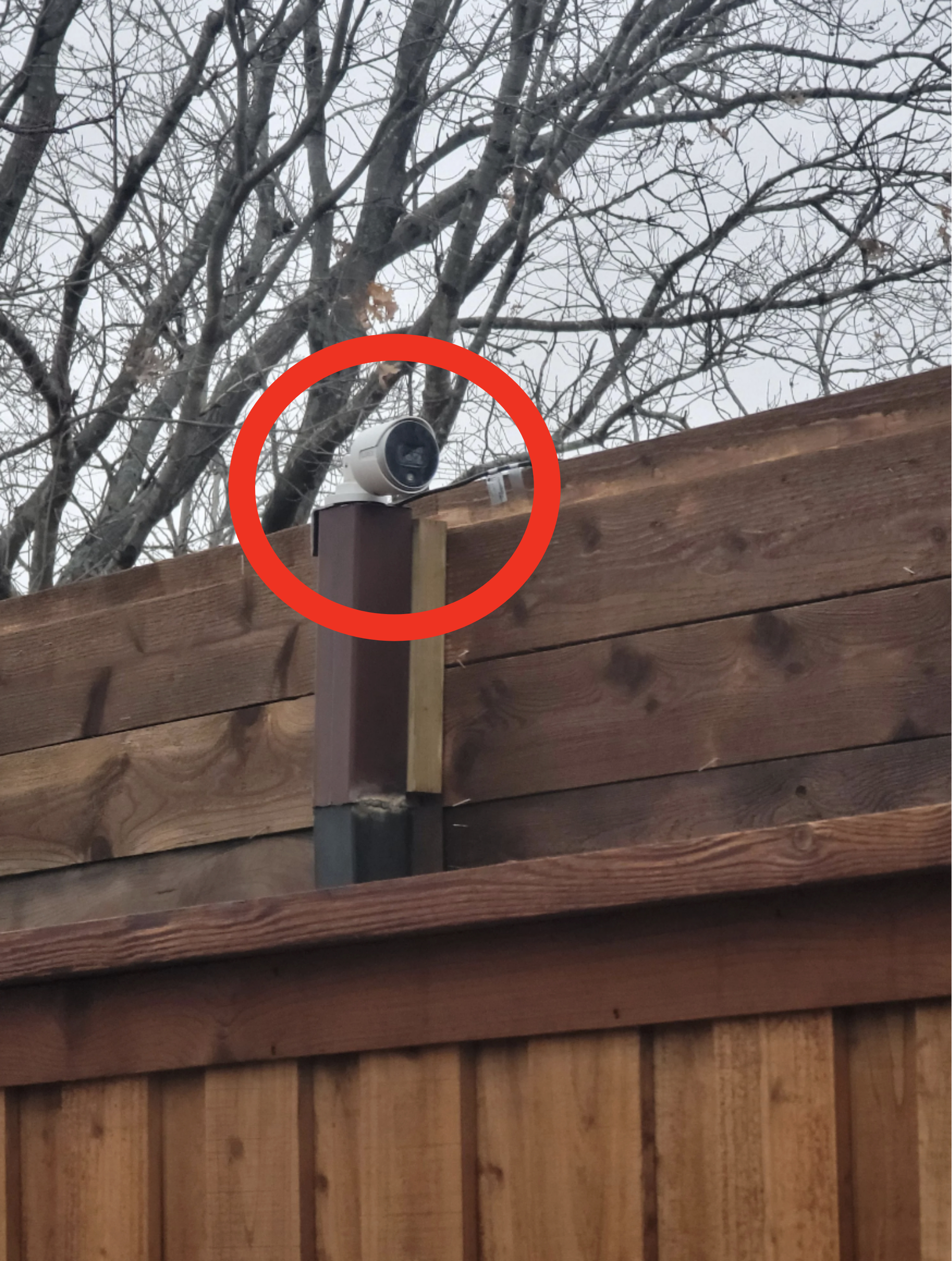 a camera looking into a neighbor's backyard
