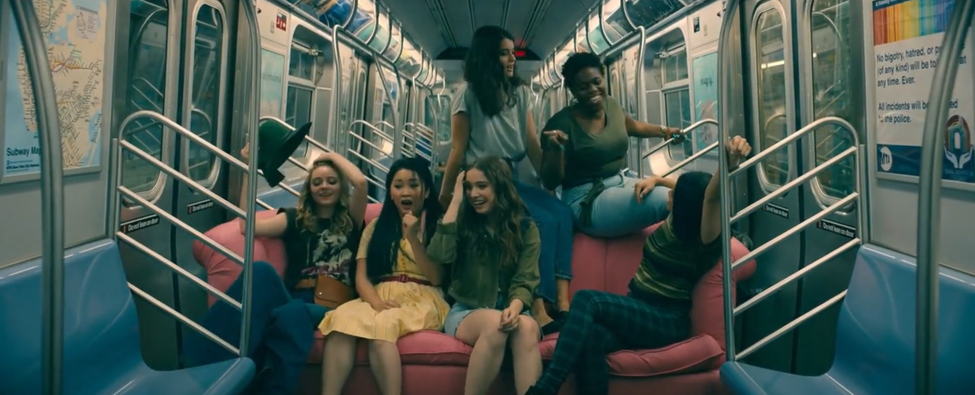 Lara Jean, Gen, Christine, and other friends are on the subway together
