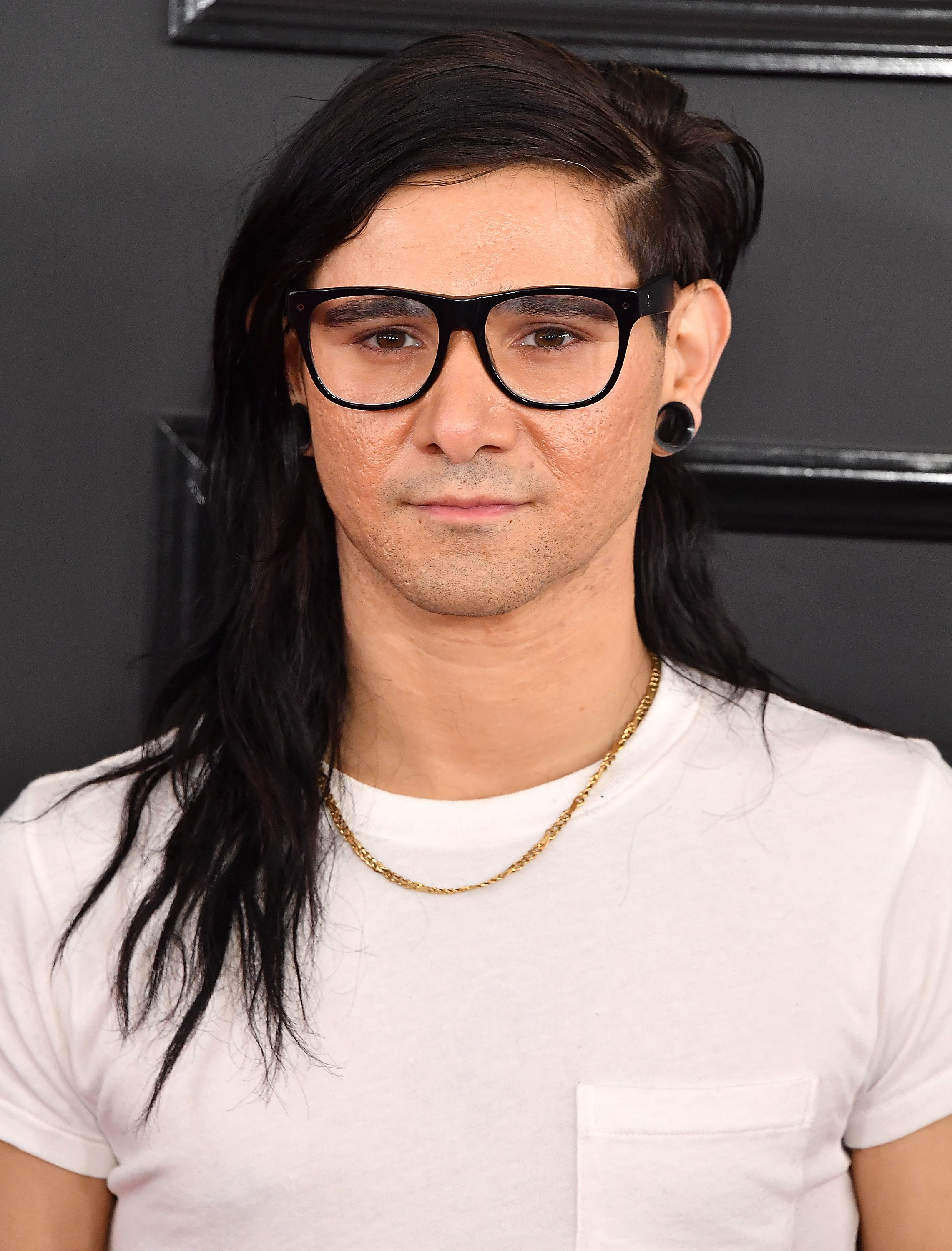 Close-up of Skrillex showing the thin chain necklace he&#x27;s also wearing