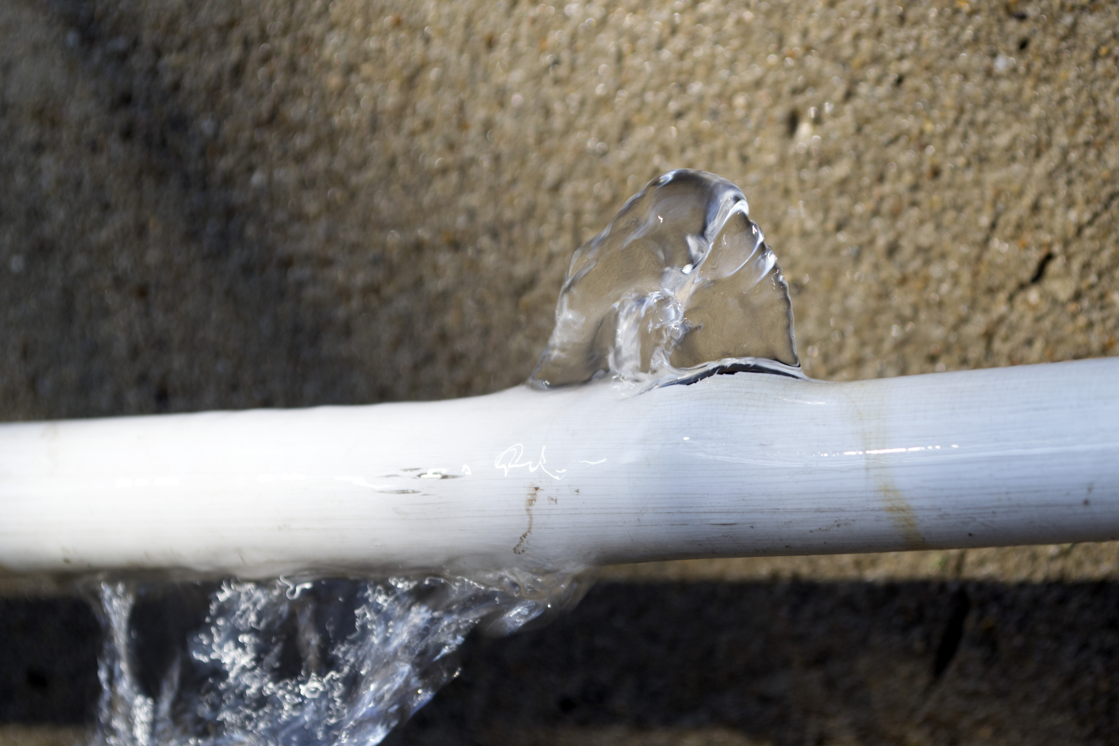 Burst pipe with water gushing out