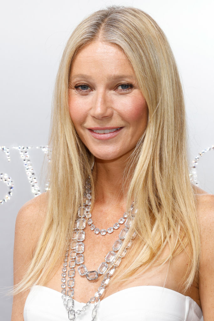 Close-up of Gwyneth in a strapless outfit and multistrand necklace at a media event