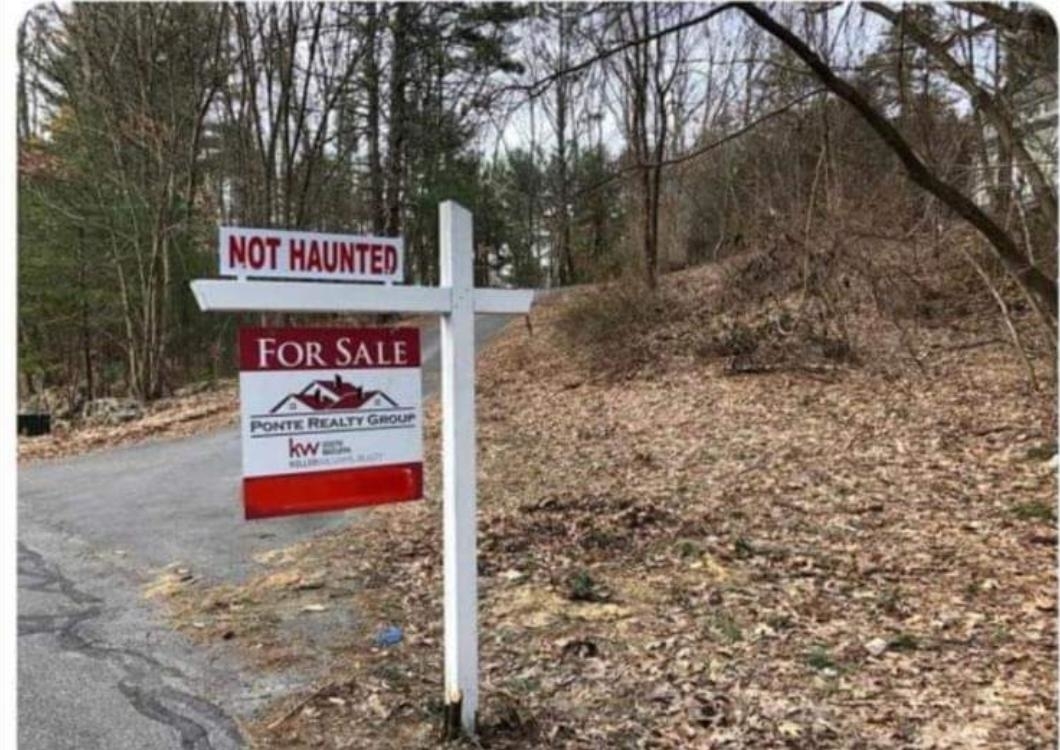 house for sale sign also says, not haunted