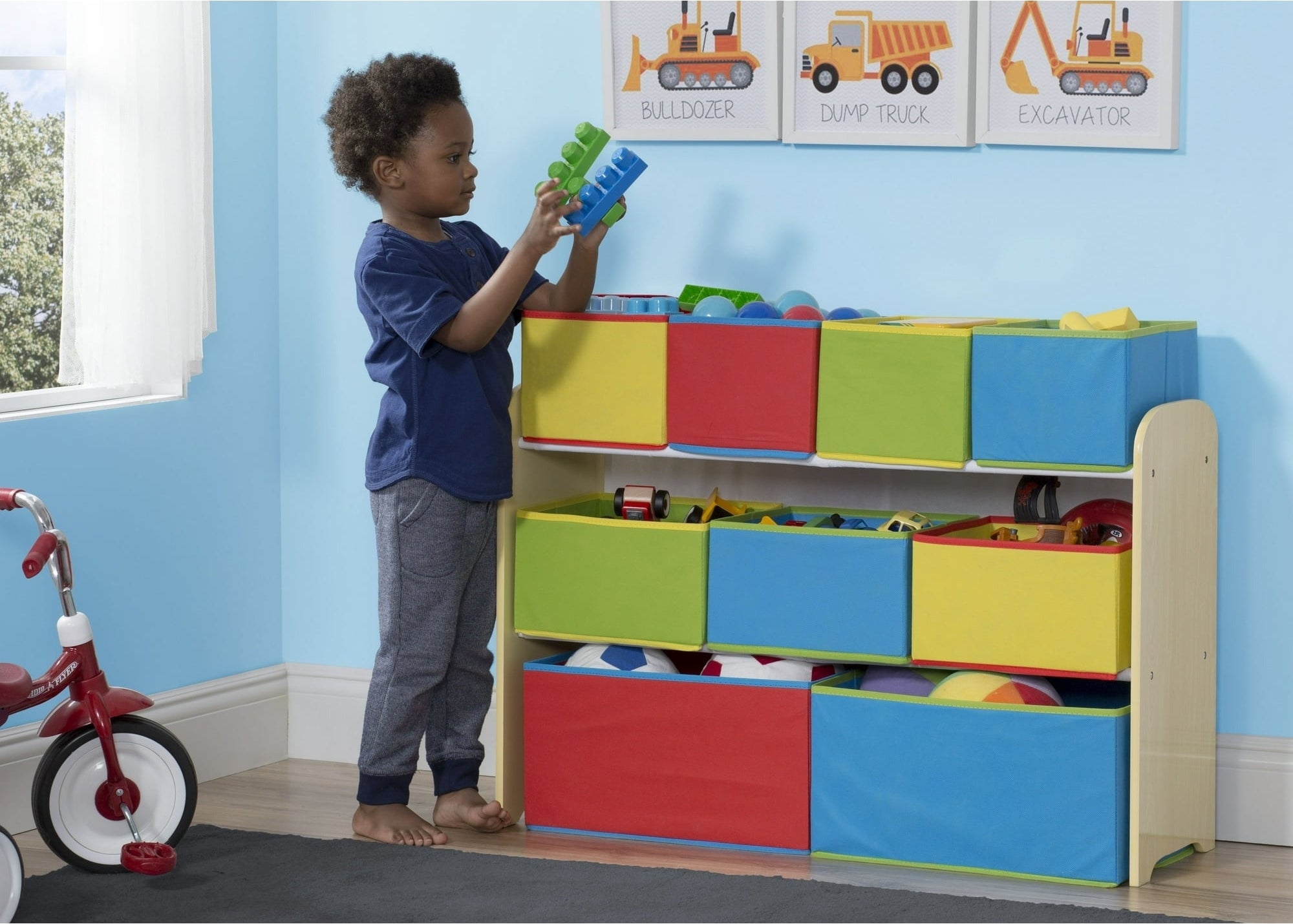 A child plays near a toy organizer