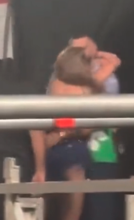 Taylor and Travis embracing