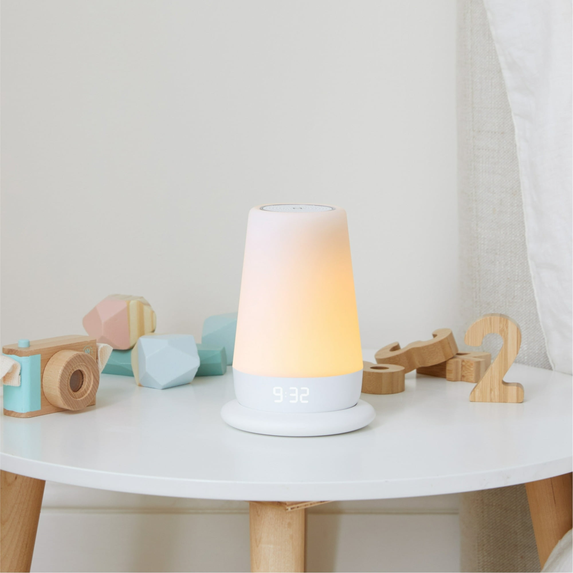 A Hatch white noise machine / lamp on a table