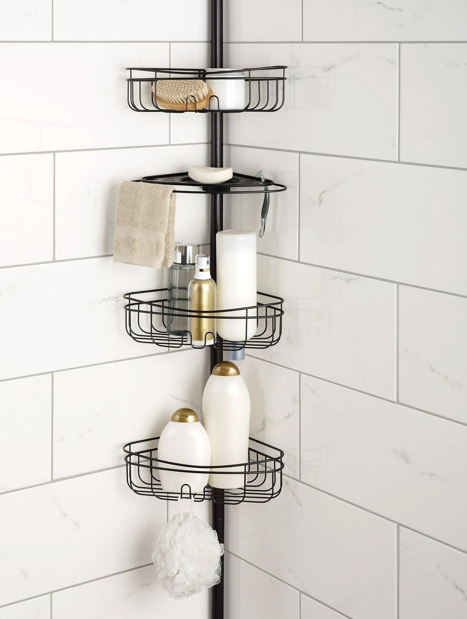 the shower caddy in the corner of a shower with multiple shelves