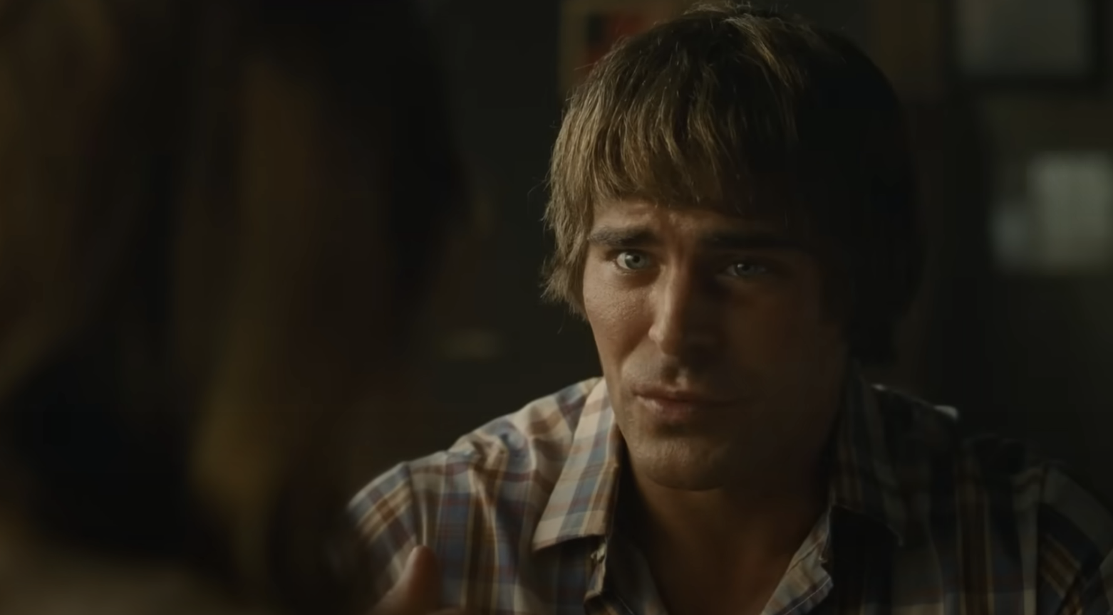 Close-up of Zac with bangs, looking distressed