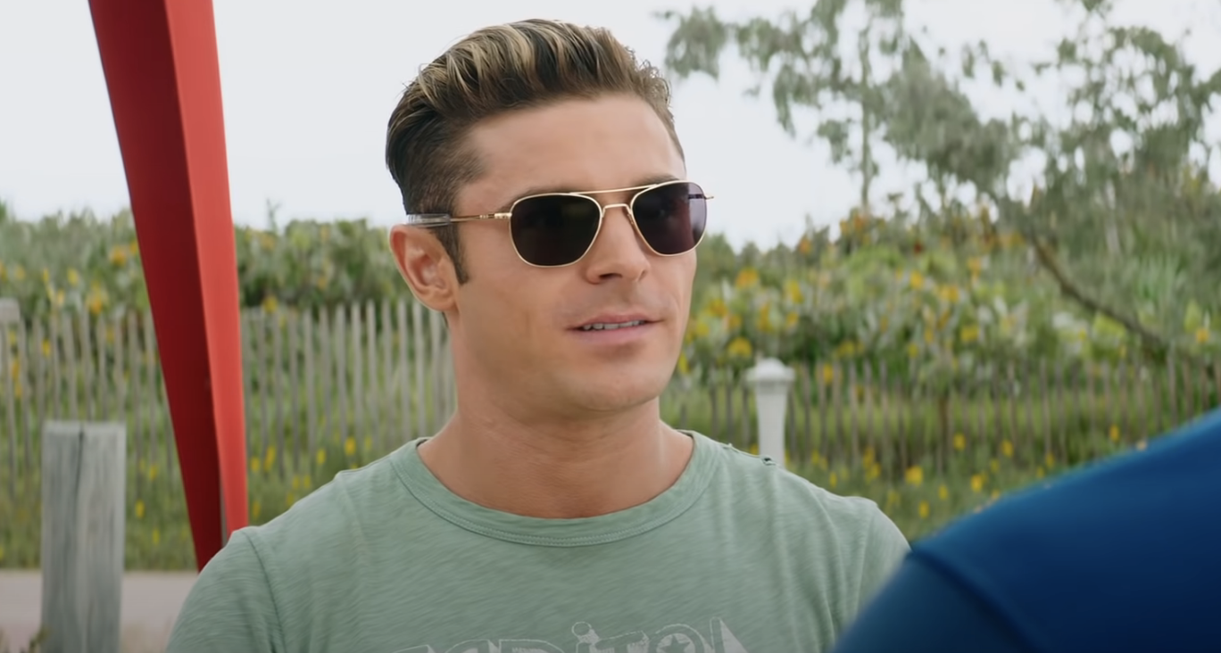 Close-up of Zac wearing sunglasses and a T-shirt