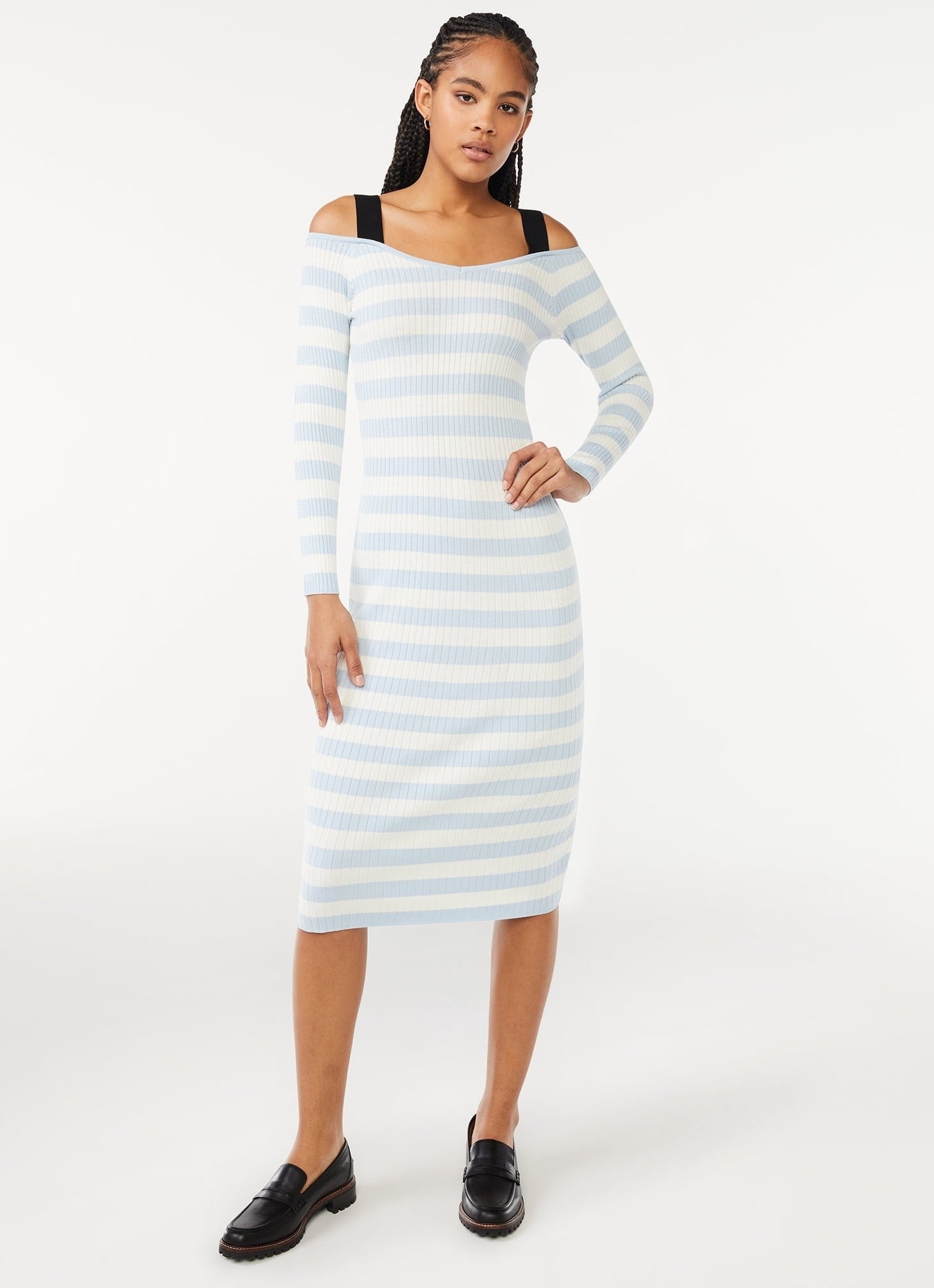 model wearing the light blue and white striped dress with black straps