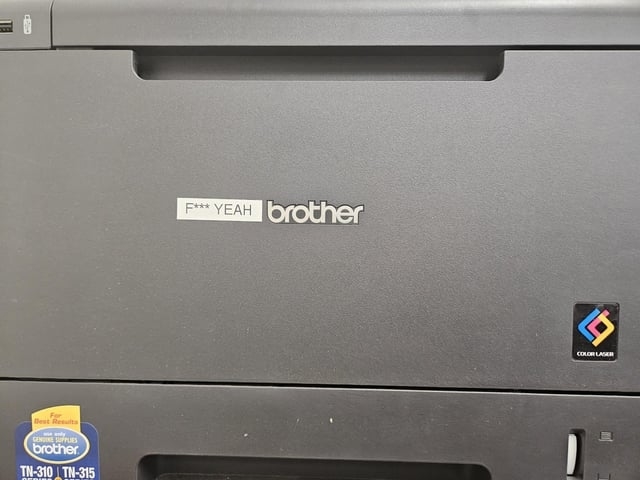 a brother printer gets an added labeled so that it reads, fuck yeah brother