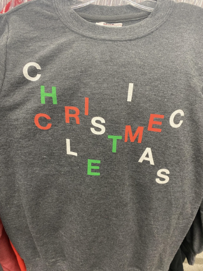 A Christmas shirt with the letters arranged terribly