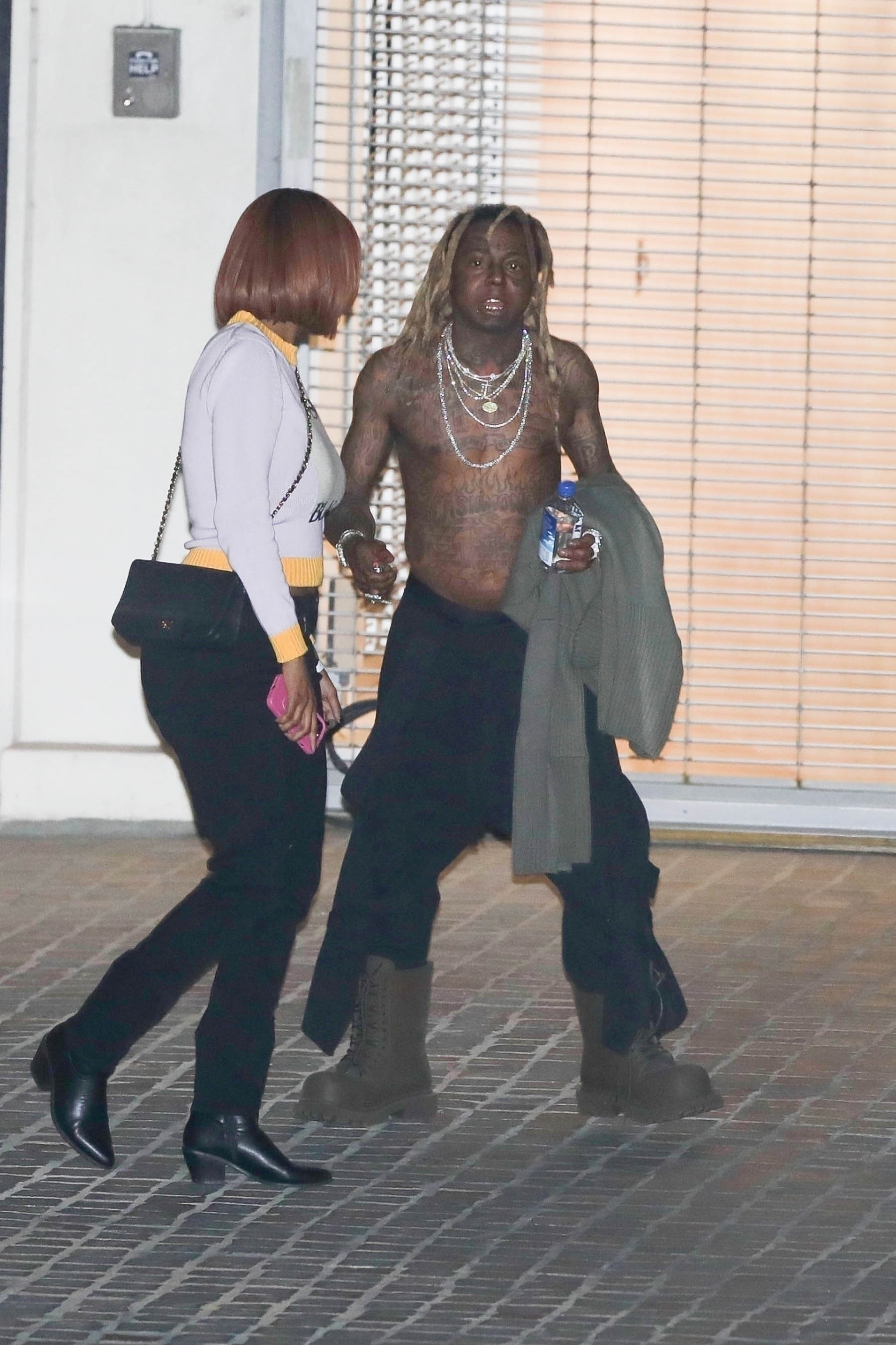 A shirtless Lil Wayne