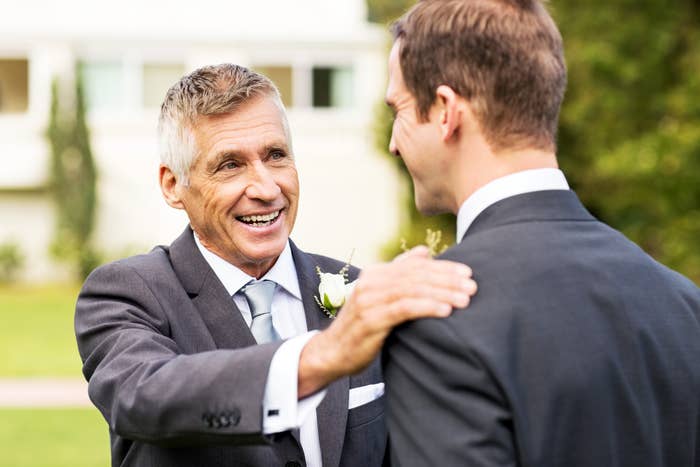 a father and son at a wedding