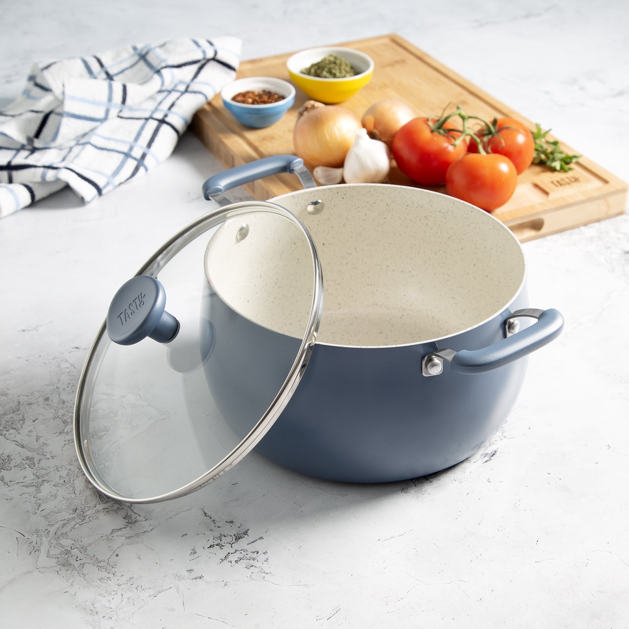 A dutch oven and lid on a counter