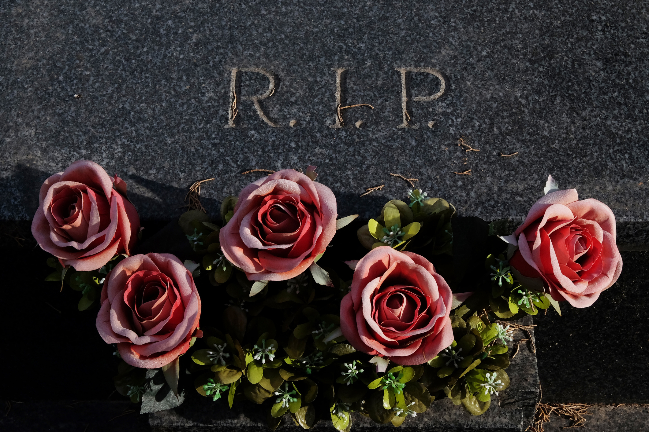 A grave with flowers on it