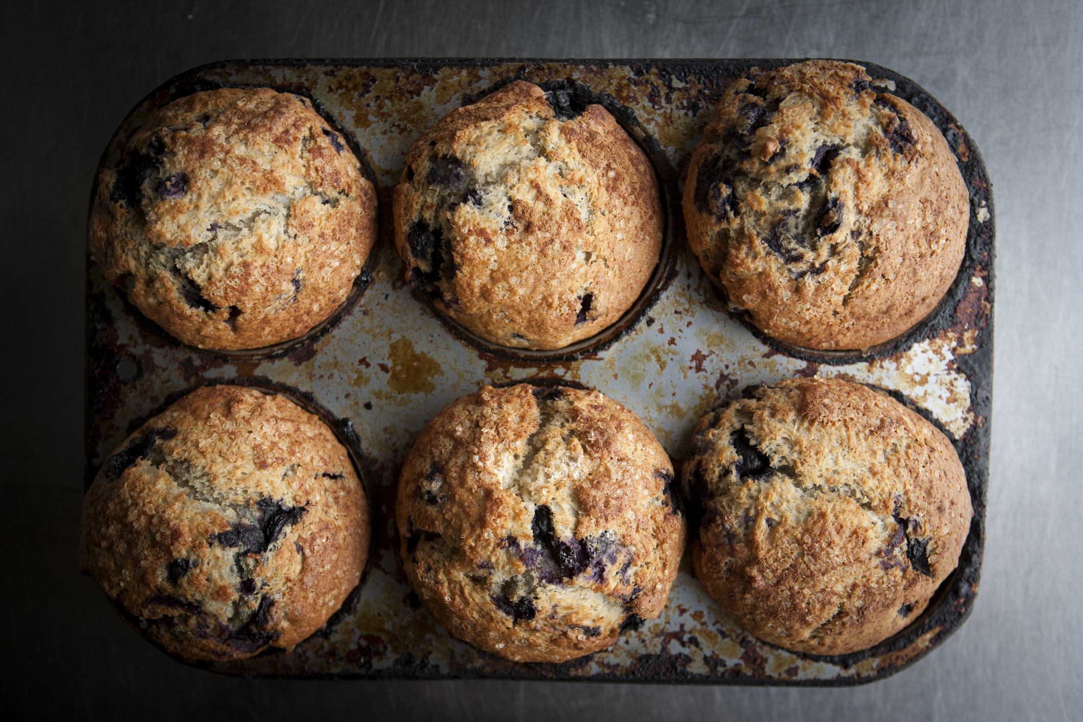 baked blueberry muffins in a muffin pan