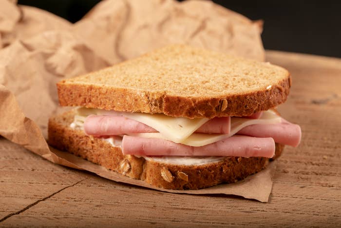 a close up of a ham and cheese sandwich