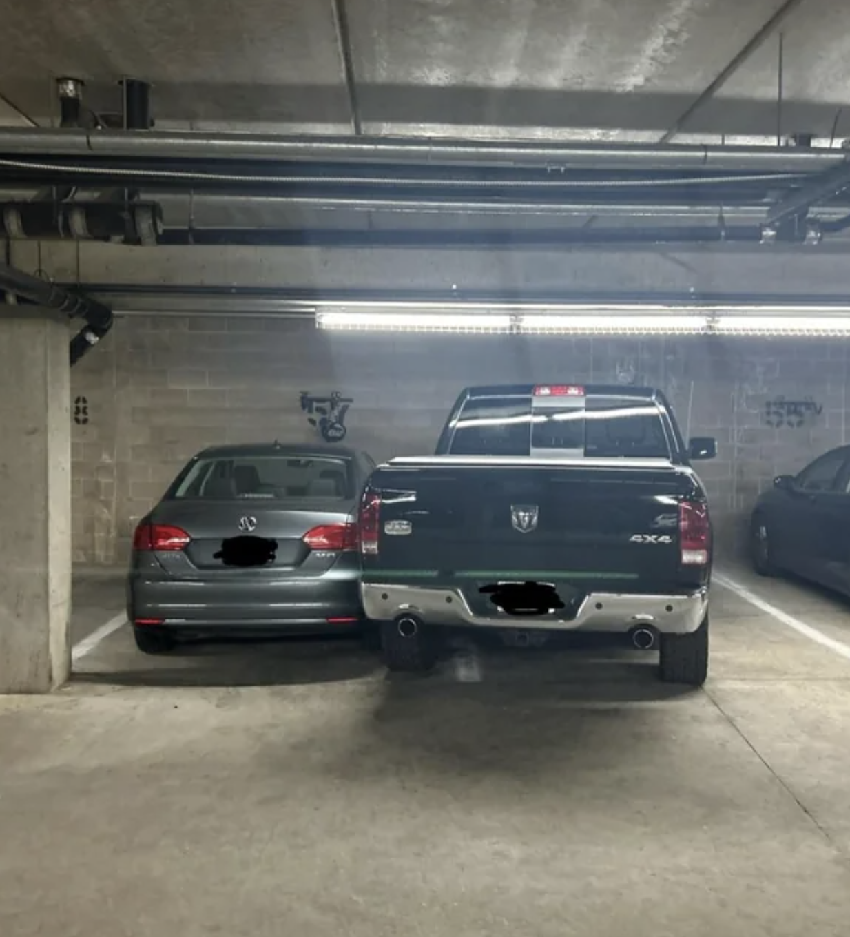 truck blocking in a car that is within the parking spot lines