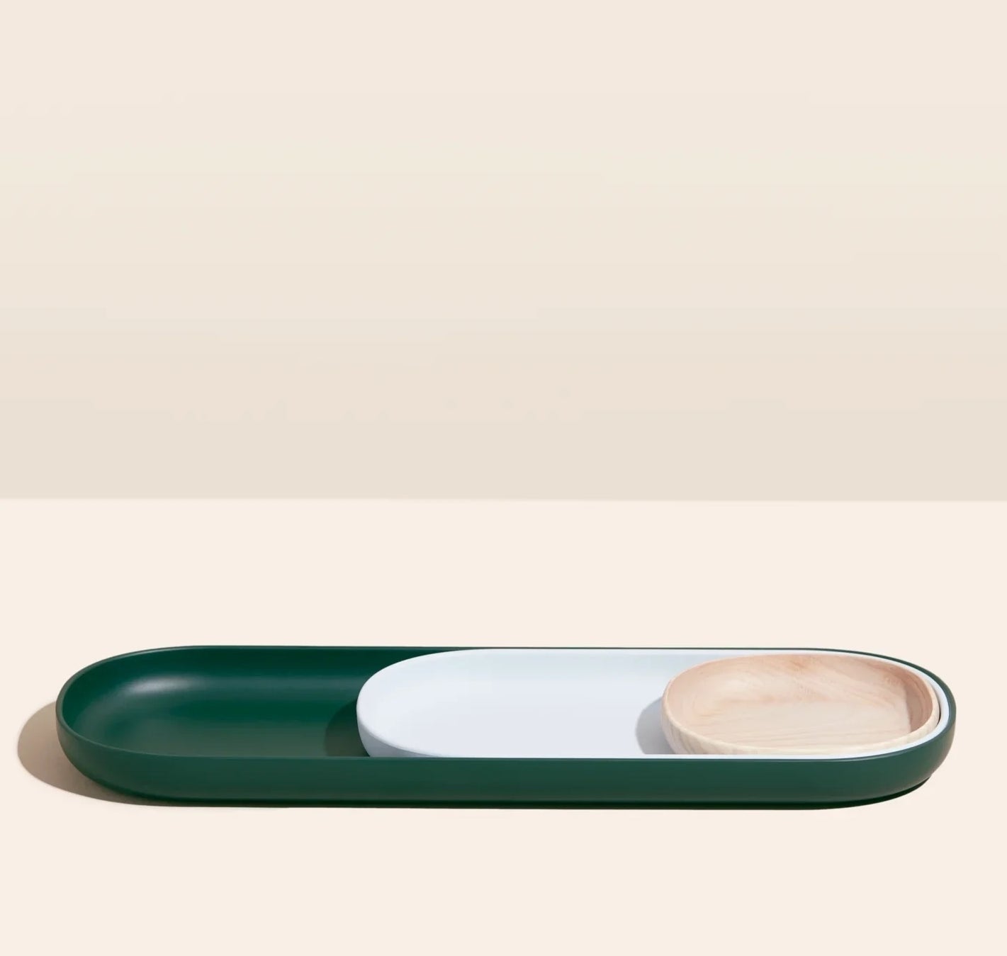 flat oblong nesting trays in natural light wood, light grey, and dark green