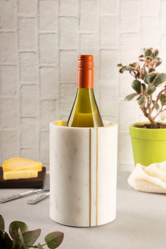 white marble wine bottle chiller with golde vertical stripe details
