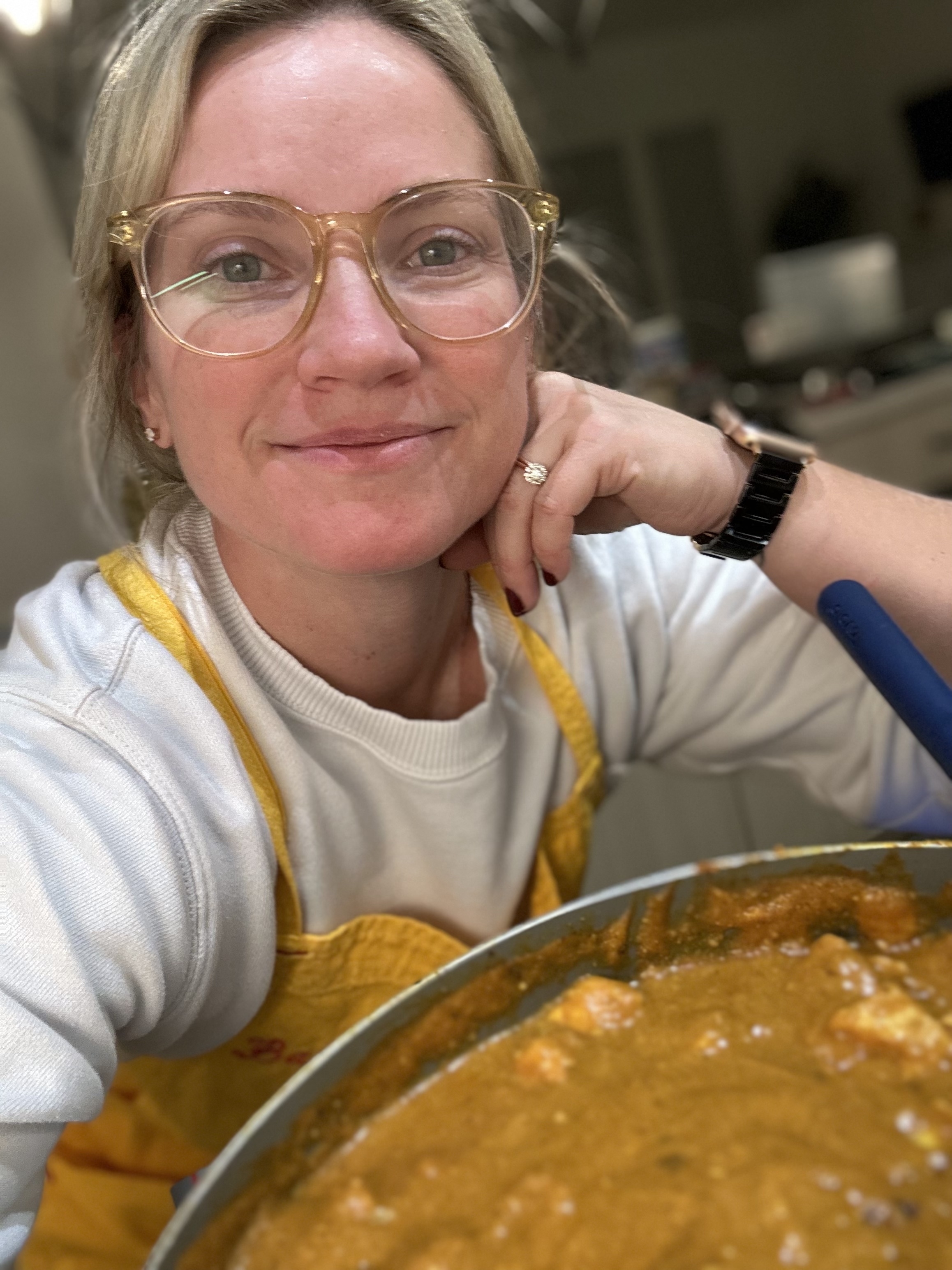The author at the stove with pumpkin curry