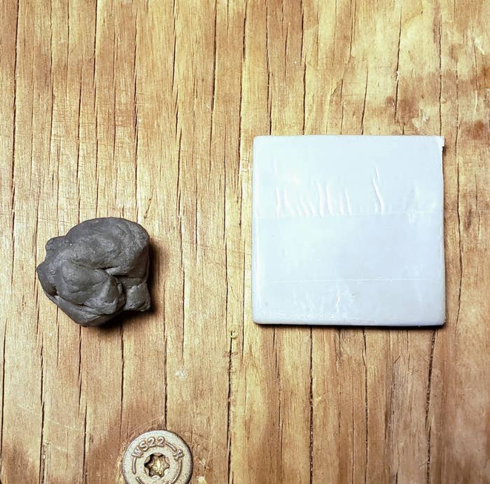 An eraser kneaded into a ball and blackened, next to a clean square eraser