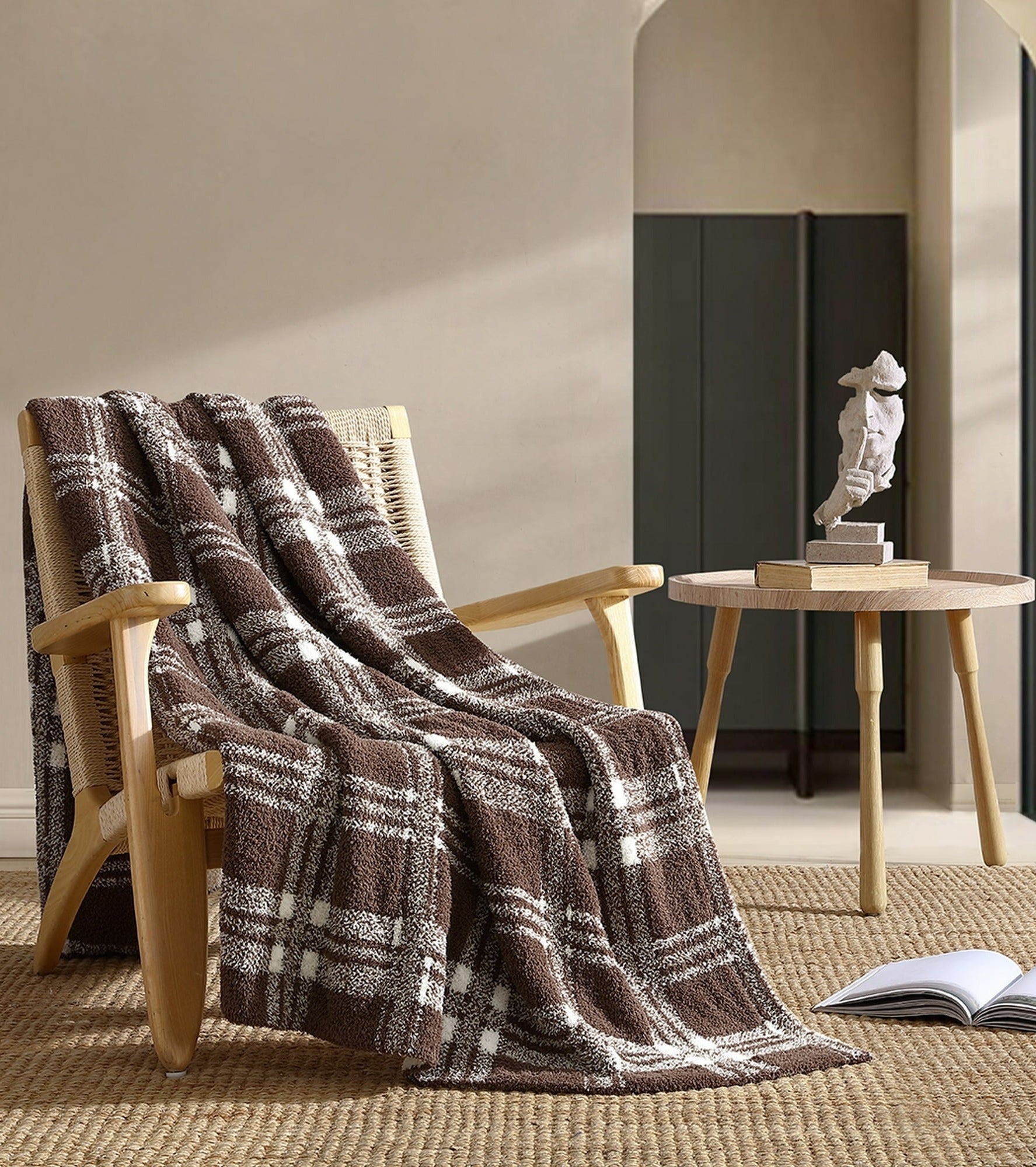 brown and white throw blanket on chair