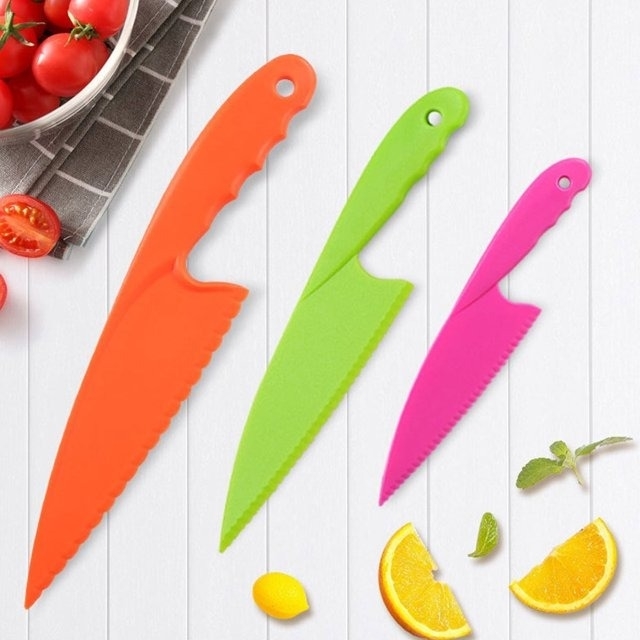 orange, green, and pink kid-sized knife set