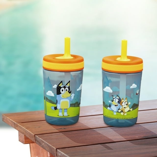 blue and green Bluey-printed sippy cups with straws